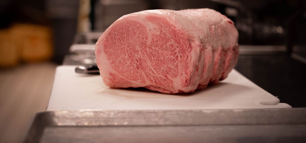 Raw cut of Wagyu beef ready to be prepared at 801 Chophouse.